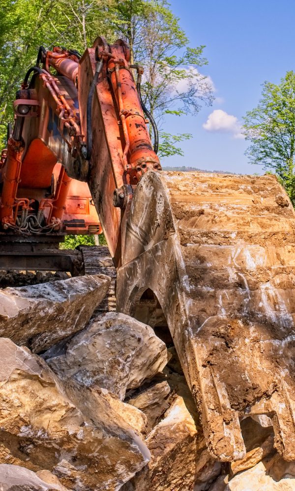 Excavator loader machine at road construction site