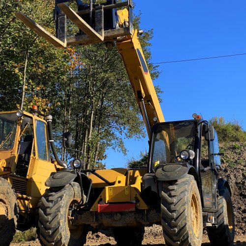 The forklift outdoors in the construction area on a sunny day