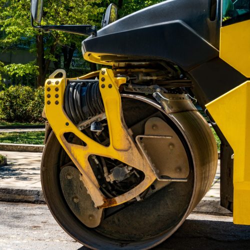 Close view of drum roller at the construction site, working on the new road