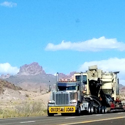 oversize-load-on-a-truck-with-mountain-view-2026-03-23-23-04-09-utc
