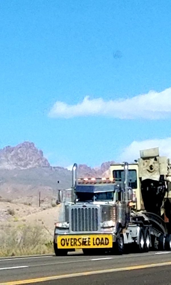 oversize-load-on-a-truck-with-mountain-view-2026-03-23-23-04-09-utc